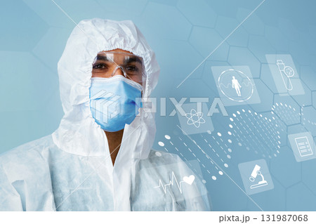 Healthcare professional in protective gear with health icons in the background Healthcare professional in protective gear with health icons in the background 131987068