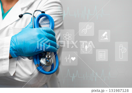 Healthcare professional holding a stethoscope in a clinical environment with medical icons Healthcare professional holding a stethoscope in a clinical environment with medical icons 131987128