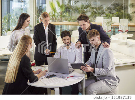 Group of business people sitting at desk on workplace on meeting discussing finance growth. 131987133