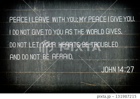 The Bible verse John 14:27 on chalkboard. 131987215