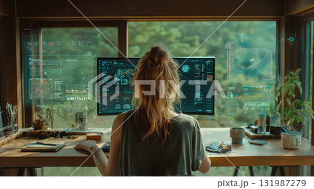 自然に囲まれたデジタルワークスペースでデータ解析をパソコンで行う女性 131987279