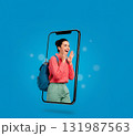 Young woman emerging from smartphone, joyful expression 131987563