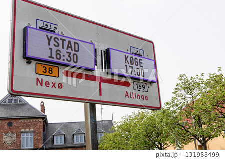 Information board or sign about ferry departures to the Swedish city of Ustad and the Danish city of Koge. 131988499