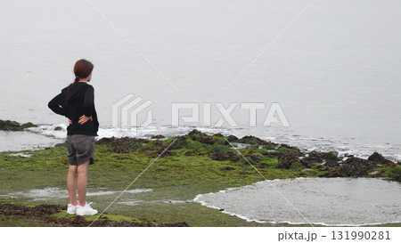 Young woman on the beach 131990281