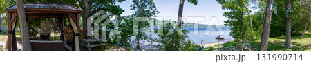 Panoramic view of the backyard of a cottage on Lake Champlain Panoramic view of the backyard of a cottage on Lake Champlain 131990714