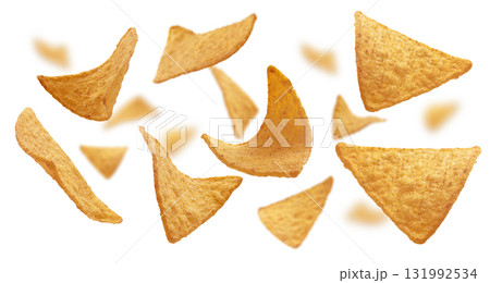 Corn chips of triangular shape levitate on a white background 131992534