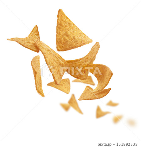 Corn chips of triangular shape levitate on a white background Corn chips of triangular shape levitate on a white background 131992535