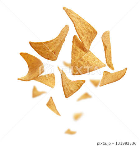 Corn chips of triangular shape levitate on a white background Corn chips of triangular shape levitate on a white background 131992536
