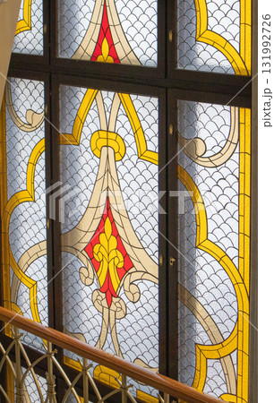 Stained glass window with gothic pattern and golden accents Stained glass window with gothic pattern and golden accents 131992726