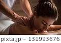 An expert female masseuse meticulously provides a calming back massage to a woman client, promoting professional wellness and total body relaxation at a luxury spa. AI Generated 131993676