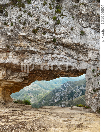 view of La Foradada rock arch in Serra del Montsia 131996804