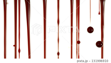 Freeze Motion of Photograph of Dripping Blood Forming Thin Streams and Scattered Droplets on a Clean White Background. Ideal for Horror, Medical, or Crime Related Visual Concepts. Realistic and Freeze Motion of Photograph of Dripping Blood Forming Thin Streams and Scattered Droplets on a Clean White Background. Ideal for Horror, Medical, or Crime Related Visual Concepts. Realistic and 131996910