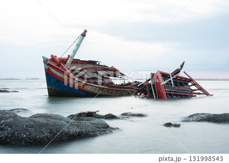 Old wrecked fishing boat on coast of Ang Sila Village, Chonburi Province of thailand. Old wrecked fishing boat on coast of Ang Sila Village, Chonburi Province of thailand. 131998543