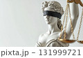 Close up of blindfolded Lady Justice statue with scales 131999721