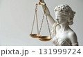 Elegant Lady Justice Statue with Balanced Scales 131999724