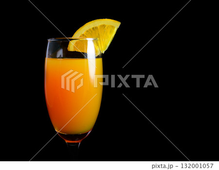 Mimosa cocktail with a slice of orange 132001057