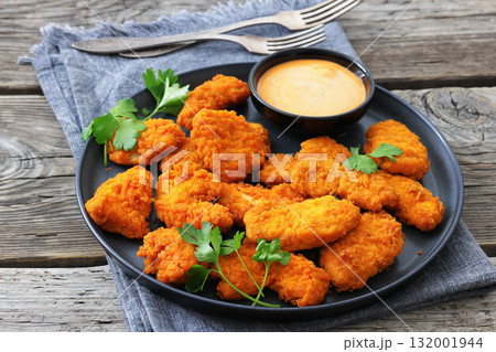 breaded chicken breast chunks with dipping sauce breaded chicken breast chunks with dipping sauce 132001944