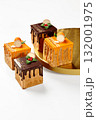 Delicious brown family christmas cakes displayed on white background 132001975