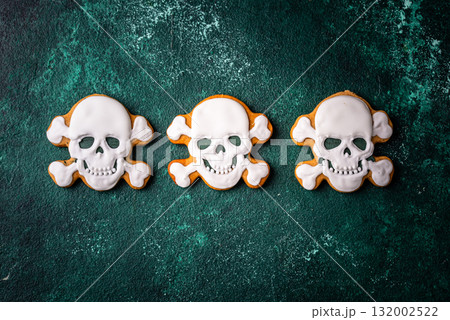 Halloween cookies in shape of ghost, jack-o-lantern and skull 132002522