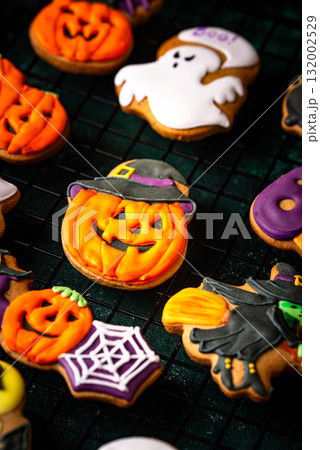 Halloween cookies in shape of ghost, jack-o-lantern and skull 132002529