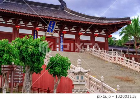 A traditional stone bridge with red lanterns in Nianshan Park, Sanya, Hainan, China. 132003118
