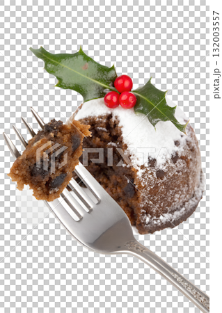 Fork with piece of traditional christmas pudding with brandy sauce and holly, festive dessert isolated on transparent background 132003557