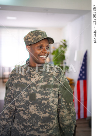 Smiling Soldier Standing Next to Flag Smiling Soldier Standing Next to Flag 132003867