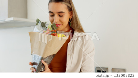 Love, flowers surprise and woman in home with romantic surprise with plant gift on anniversary event. Floral bouquet, calm woman and relax with present for wife for celebration in a home with smile 132005822