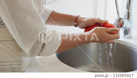 Water, hands and cleaning tomato for cooking food, salad or dinner in basin of kitchen at home. Vegetables, woman and washing produce for healthy diet, lunch or nutrition with vegan lifestyle or meal Water, hands and cleaning tomato for cooking food, salad or dinner in basin of kitchen at home. Vegetables, woman and washing produce for healthy diet, lunch or nutrition with vegan lifestyle or meal 132005827