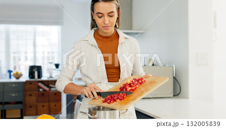 Woman, cooking vegetables and knife in kitchen, home and thinking with recipe, care and idea by pot. Chef, vegan nutrition and prepare food with tomatoes, pepper or healthy choice for diet in house Woman, cooking vegetables and knife in kitchen, home and thinking with recipe, care and idea by pot. Chef, vegan nutrition and prepare food with tomatoes, pepper or healthy choice for diet in house 132005839