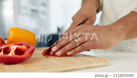 Hands, food and man in kitchen with cooking, vegetables and salad of dinner for healthy lifestyle. Chef, apartment and married with meal prep for vegan diet with organic ingredients and nutrition Hands, food and man in kitchen with cooking, vegetables and salad of dinner for healthy lifestyle. Chef, apartment and married with meal prep for vegan diet with organic ingredients and nutrition 132005840