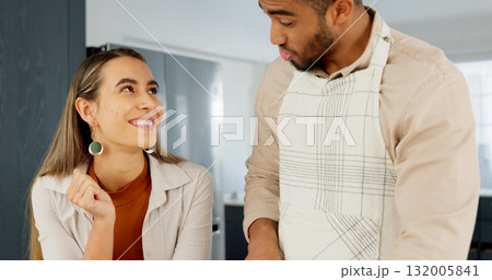 Young couple, kitchen and people cooking in Mexico apartment and man joke or silly with girlfriend or smile. Face of happy woman talking, bonding on home date and love with funny time together Young couple, kitchen and people cooking in Mexico apartment and man joke or silly with girlfriend or smile. Face of happy woman talking, bonding on home date and love with funny time together 132005841