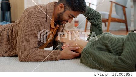 Property, success and couple relax on living room floor for moving, break or new home smile. Mortgage, real estate and man with woman lying on a carpet happy, investment or love with face touch care Property, success and couple relax on living room floor for moving, break or new home smile. Mortgage, real estate and man with woman lying on a carpet happy, investment or love with face touch care 132005959