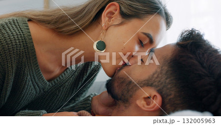 Couple kiss, love and passion with trust at home, trust and care for intimacy and bonding. People relax together, support and security with romance, partner and commitment in healthy relationship 132005963