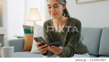 Happy woman relax on sofa with phone, credit card and banking for ecommerce on social media store in home. Online shopping, payment or digital app, girl with smile in living room and budget in house. 132005997