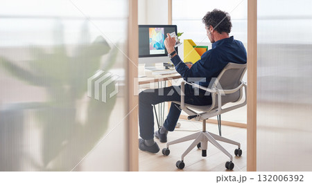 Magazine, planning or graphic designer man on computer for creative research, web page strategy or branding. Startup, office or employee at desk working on project for marketing or advertising blog Magazine, planning or graphic designer man on computer for creative research, web page strategy or branding. Startup, office or employee at desk working on project for marketing or advertising blog 132006392