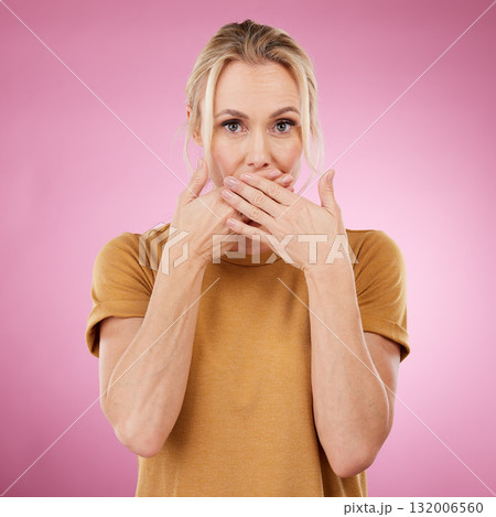 Secret, studio and woman with her hand on her mouth with a shock, surprise or quiet face expression. Gossip, shocked and portrait of a female model with surprised gesture isolated by pink background. 132006560