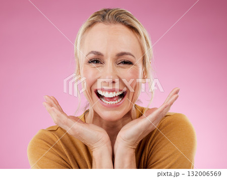 Excited portrait, woman and smile on pink background, studio and backdrop for celebration of happiness. Happy mature model, face and confidence to celebrate with motivation, success or surprise hands 132006569