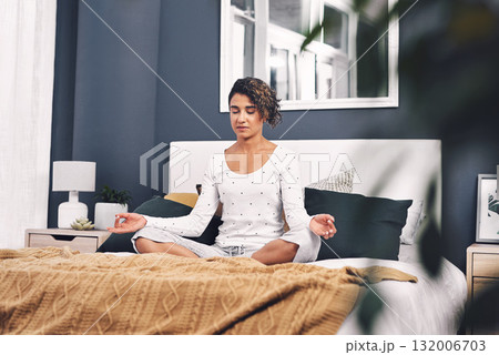 Meditation, lotus and woman exercise in home bedroom for peace, mental health and calm chakra. Female person with hands to meditate for spiritual healing, zen and holistic yoga to relax on bed 132006703