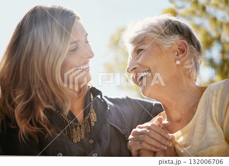 Family, love or happy with a senior mother and daughter bonding outdoor together during a summer day. Smile, flare and retirement with a young man hugging her elderly parent outside in the park 132006706