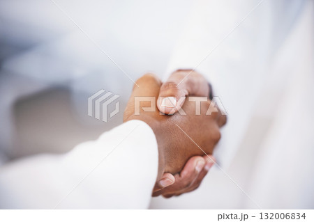 Doctor, handshake and meeting in thank you for agreement, deal or healthcare at hospital. Medical professional shaking hands with patient for healthy wellness, consultation or partnership at clinic Doctor, handshake and meeting in thank you for agreement, deal or healthcare at hospital. Medical professional shaking hands with patient for healthy wellness, consultation or partnership at clinic 132006834