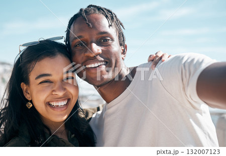 Smile, portrait and selfie of couple at beach outdoors, having fun or enjoying holiday time. Travel face, love diversity and man and woman take photo for social media, profile picture or happy memory Smile, portrait and selfie of couple at beach outdoors, having fun or enjoying holiday time. Travel face, love diversity and man and woman take photo for social media, profile picture or happy memory 132007123