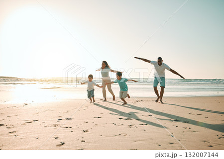 Beach, run and airplane by family playing, freedom and happy along the ocean on blue sky background. flying, game and children running with parents in Mexico for travel, trip and summer vacation Beach, run and airplane by family playing, freedom and happy along the ocean on blue sky background. flying, game and children running with parents in Mexico for travel, trip and summer vacation 132007144