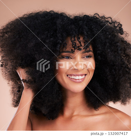 Hair care, black woman and cosmetics of a young model with a healthy afro from salon treatment. Happy face, cosmetics and African person with wellness, skincare and smile from beauty in studio 132007417