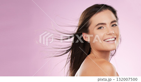 Hair care, beauty and portrait of a woman in a studio with a cosmetic, makeup and salon treatment. Happy, smile and female model with shiny and healthy hairstyle by pink background with mockup space. Hair care, beauty and portrait of a woman in a studio with a cosmetic, makeup and salon treatment. Happy, smile and female model with shiny and healthy hairstyle by pink background with mockup space. 132007500
