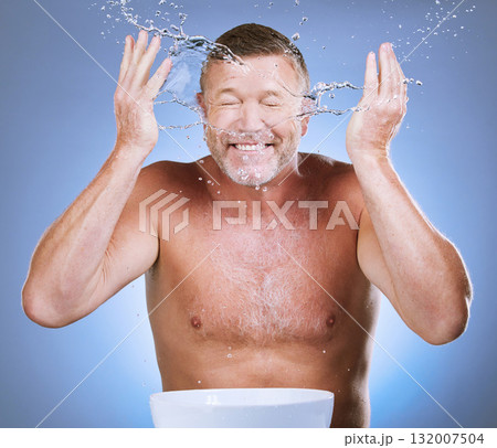 Skincare, senior man and water splash with basin, dermatology and guy with blue studio background. Face detox, mature male and old gentleman with clear liquid, hygiene or aqua for freshness with bowl Skincare, senior man and water splash with basin, dermatology and guy with blue studio background. Face detox, mature male and old gentleman with clear liquid, hygiene or aqua for freshness with bowl 132007504