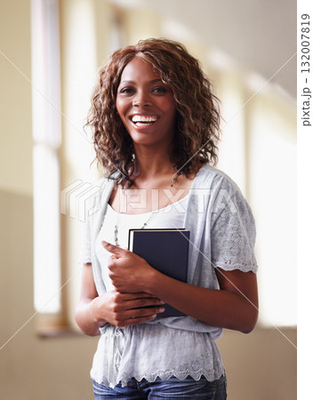 Teacher, portrait and black woman with notebook in school hallway with pride for career or job. Education, book and funny female educator in corridor ready for teaching or working in South Africa. 132007819