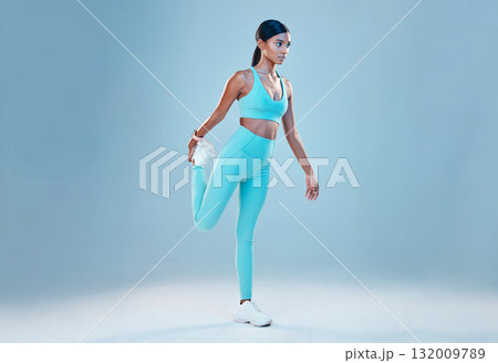 Fitness, stretching legs and mockup with a woman in studio on a gray background for health or sports. Exercise, warm up and space with a female athlete training for a healthy body or lifestyle 132009789