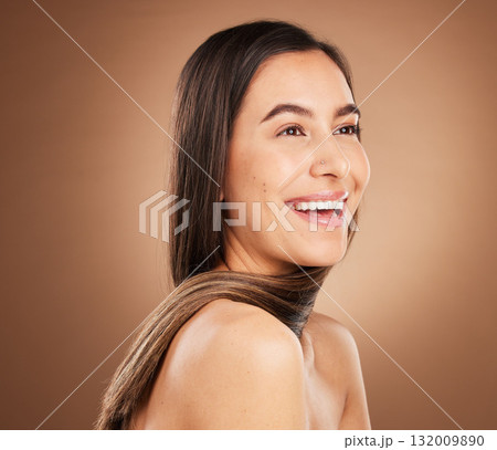 Hair, beauty and face of woman in studio for wellness, hairstyle treatment and health on brown background. Salon aesthetic, luxury glow and happy girl with cosmetics, keratin growth and natural style 132009890