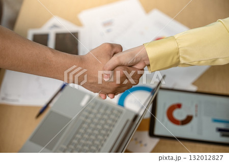 Business handshake. Asian business people making a handshake, close up. Two corporate businesspeople shaking hands during meeting in office, business union company, successful deal, teamwork, partners Business handshake. Asian business people making a handshake, close up. Two corporate businesspeople shaking hands during meeting in office, business union company, successful deal, teamwork, partners 132012827